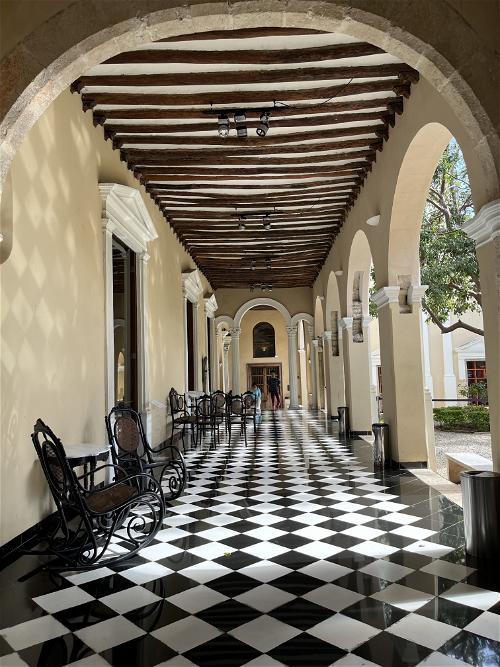 A black and white checkered floor in an old building in Merida, Mexico.