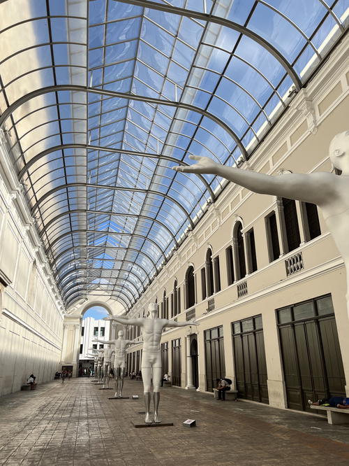 White statues in a hallway in Merida, Mexico.