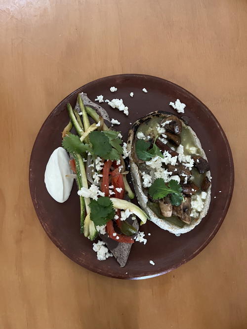 A plate with two tacos on it in Merida, Mexico.