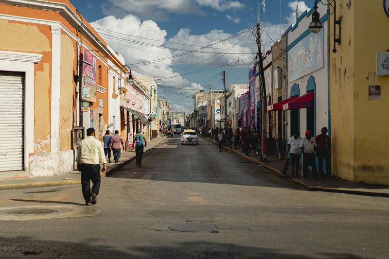 A man strolling through the streets of Merida, Mexico.