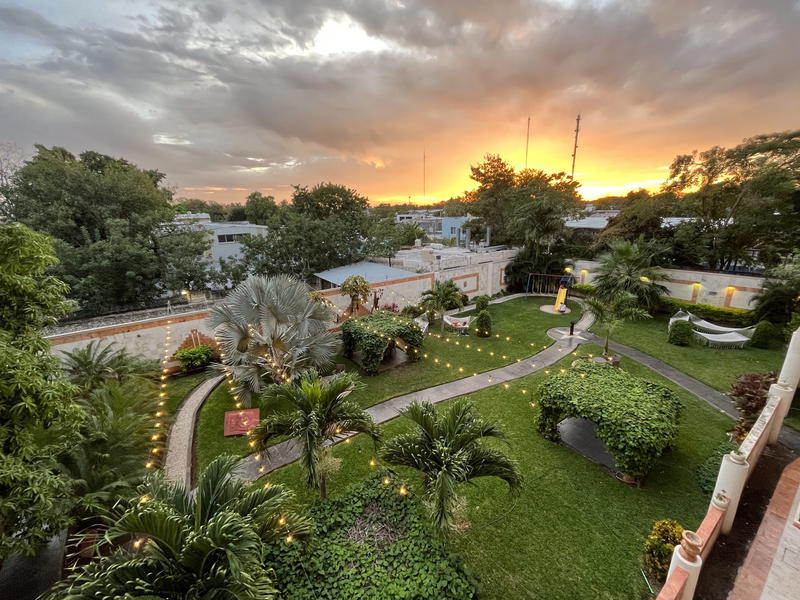 An aerial view of a garden at sunset in Merida, Mexico.
