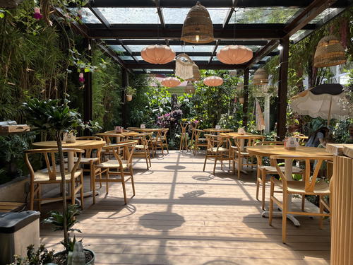 A Mexican restaurant with wooden tables and chairs in Mexico City, Mexico.