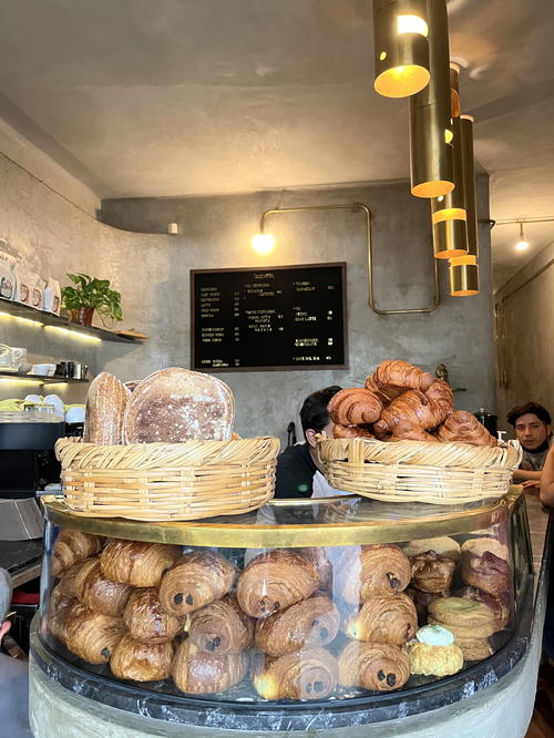 A bakery in Mexico City with baskets of pastries on display.
