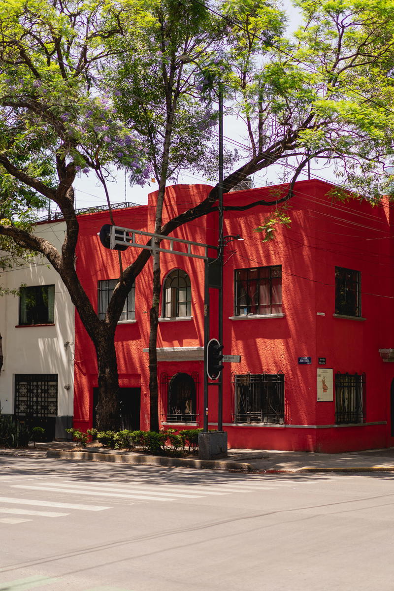a red building on the corner of a street