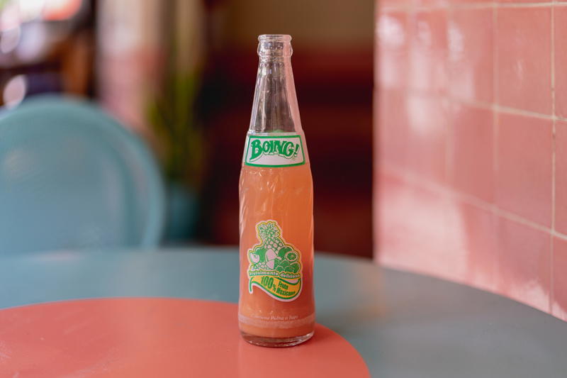 a bottle of soda sitting on top of a table