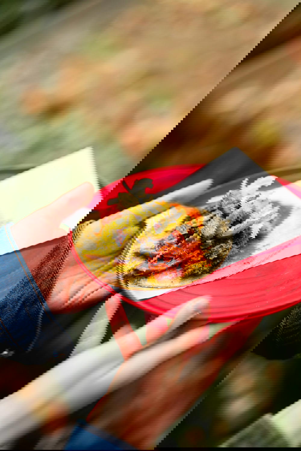 A person holding a taco in Mexico City.