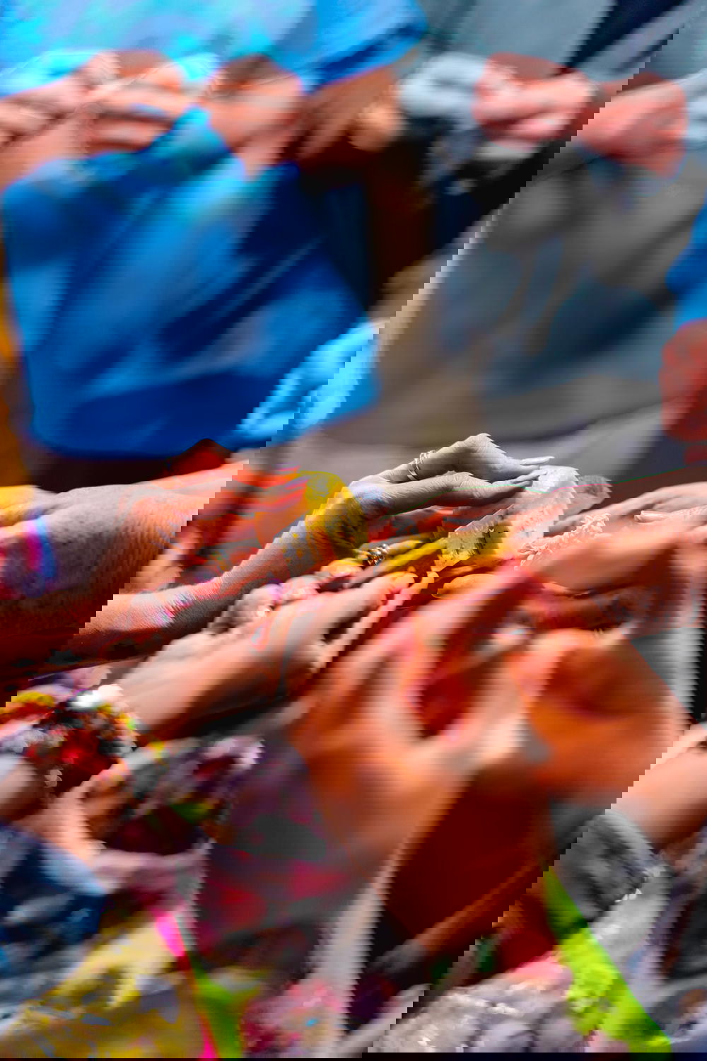 In Mexico City, a group of people grabbing a piece of fruit.