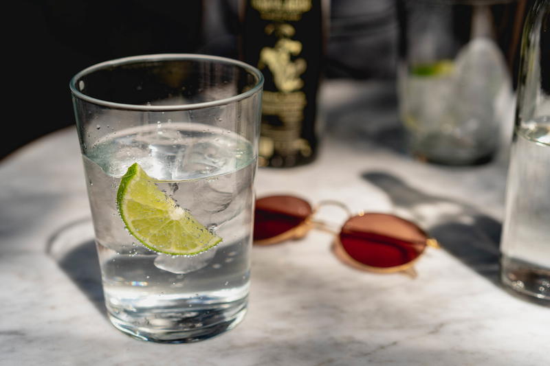 A glass of water with a slice of lime, popular in Mexico City, Mexico.