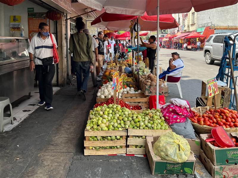 A Mexico City street market filled with an abundance of fresh fruit and vegetables.
