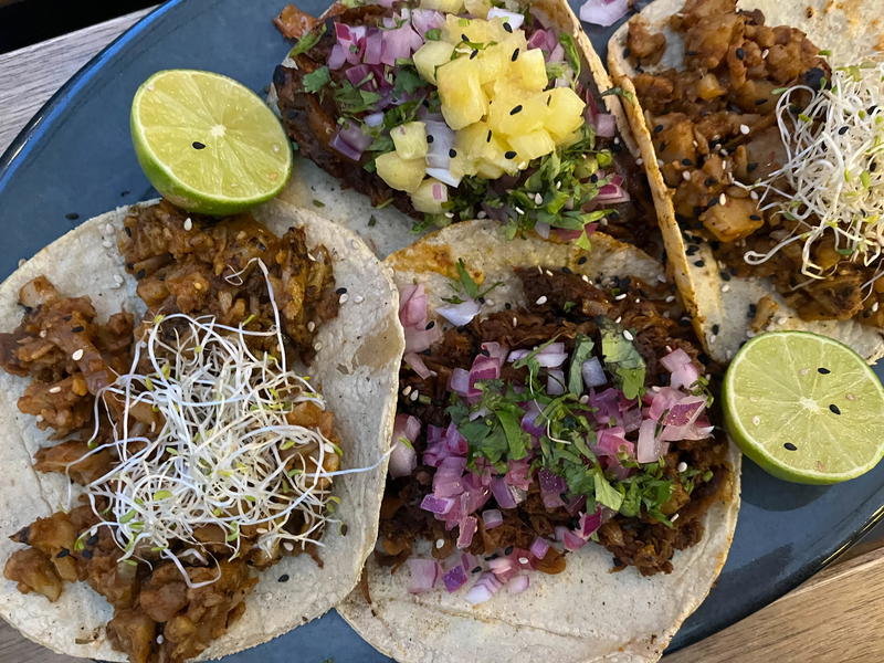 Three tacos on a plate in Mexico City.