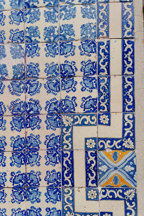 A tiled floor with blue and white designs in Mexico City.
