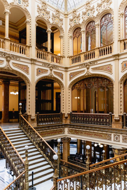 An ornate building interior in Mexico City featuring a grand staircase.