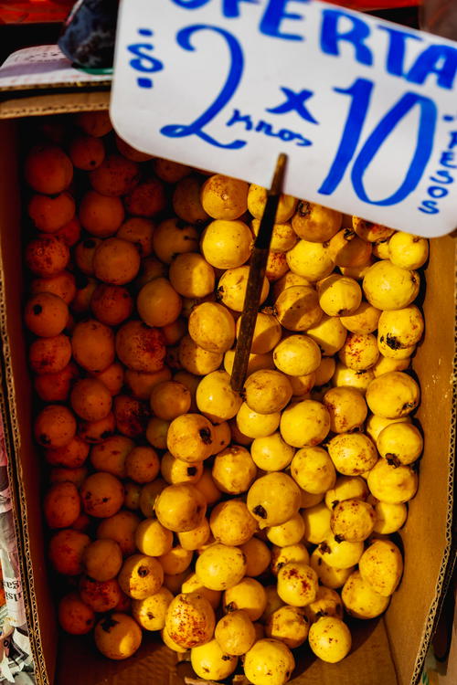 A box of yellow fruit from Mexico City.