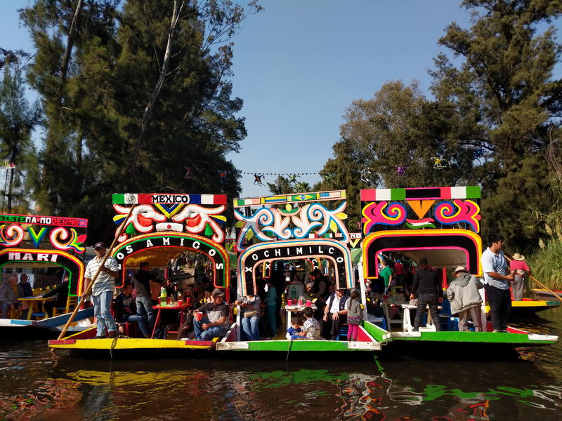 A group of boats on the river in Mexico.