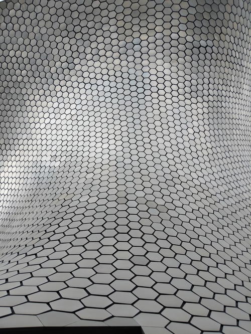 The ceiling of a building in Mexico City with a hexagonal pattern.