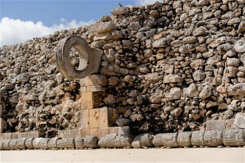 A clock-adorned stone wall in Uxmal, Mexico.