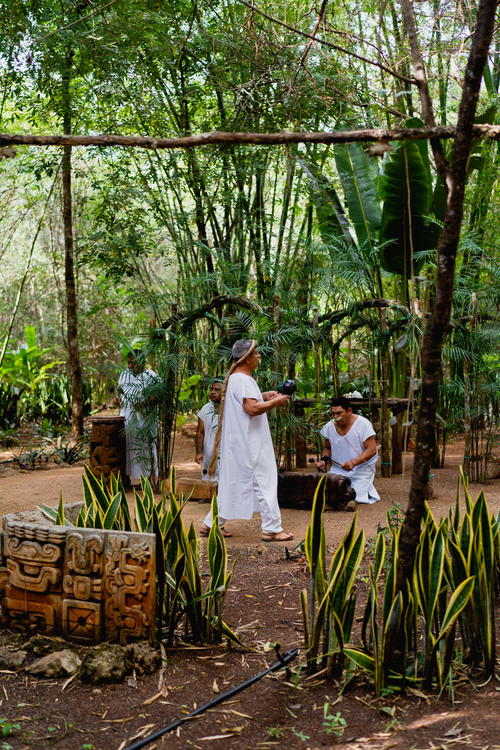 A group of people standing in a wooded area in Mexico.