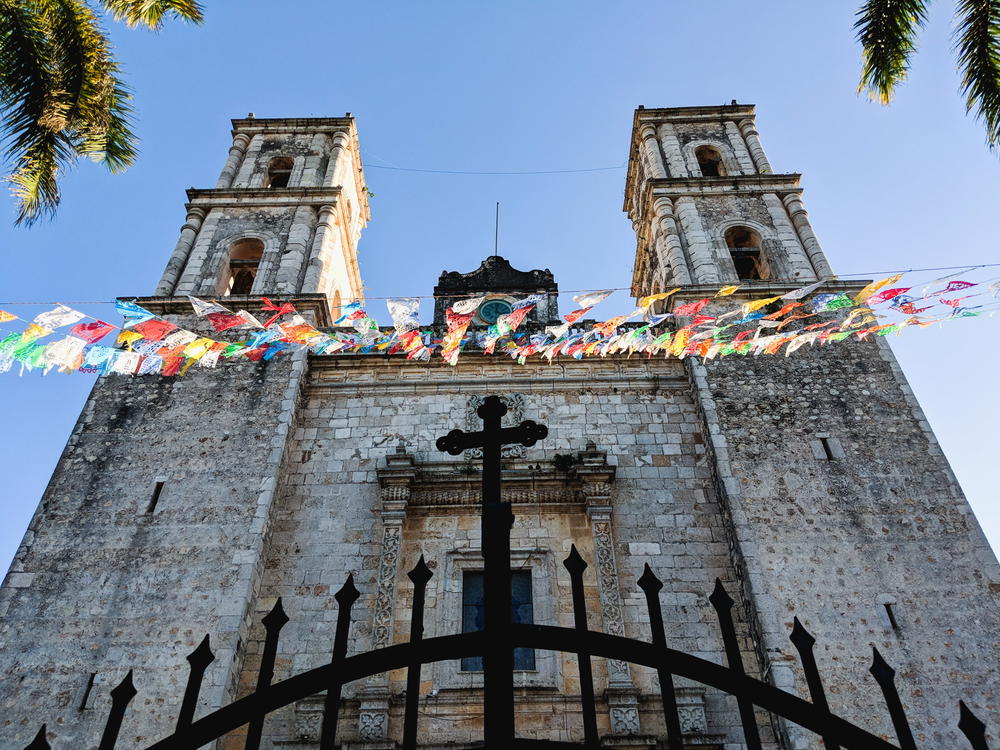 A church with two towers and a gate located in Mexico.