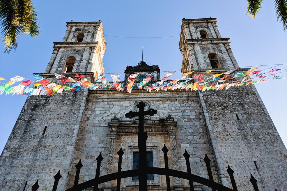 A church with two towers and a gate located in Mexico.