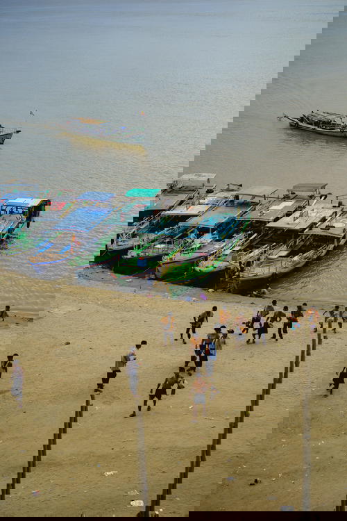 Boats docked on Irrawaddy River below Bu Paya Pagoda Bagan Myanmar Burma