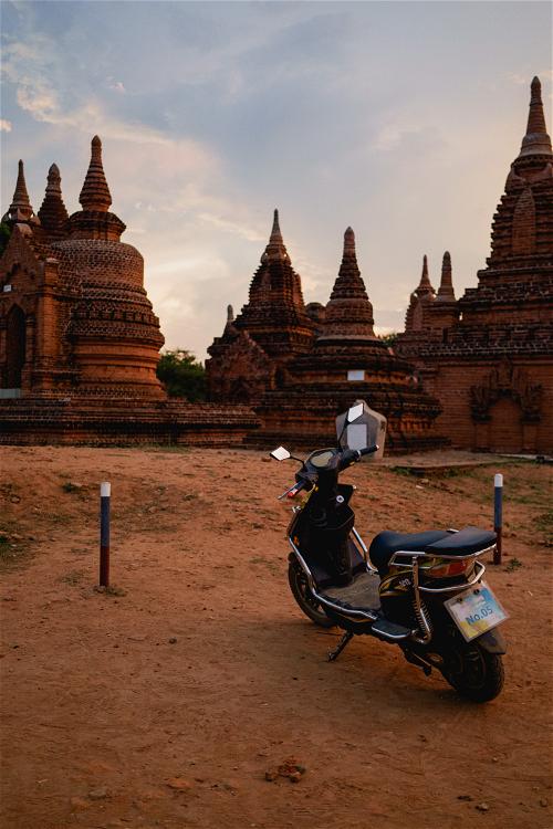 Moto e-bike parked in parking lot at best temples pagodas Bagan Myanmar Burma