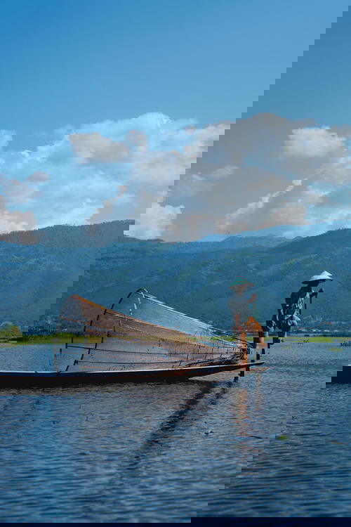 A man on a boat in Myanmar.