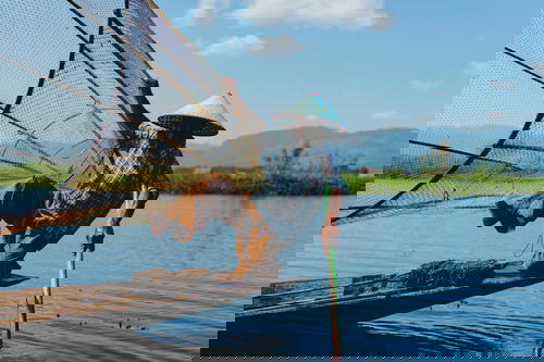 A man on a boat in Myanmar (Burma).