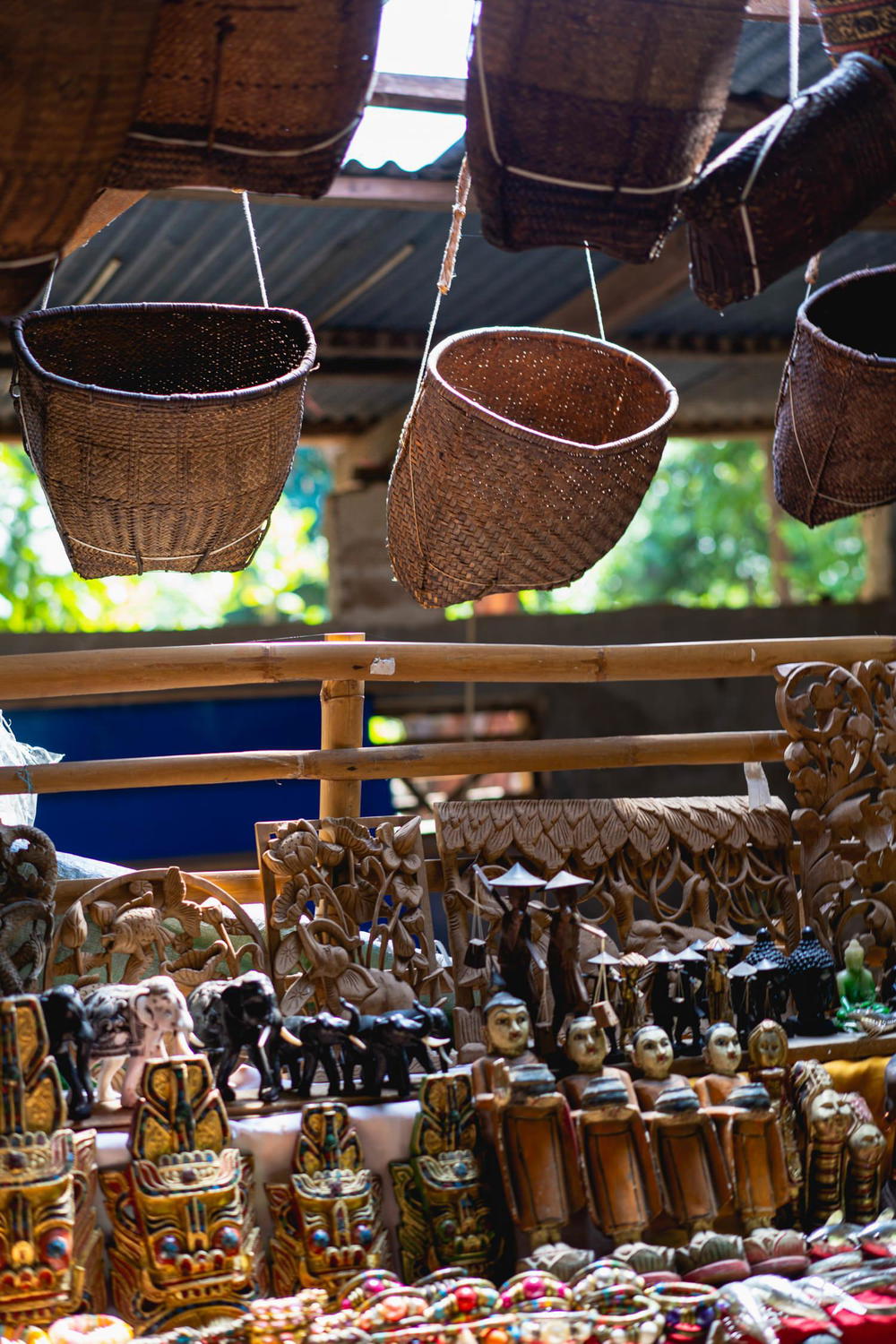 Handmade painted goods and souvenirs for sale at a vendor stall in the village market of Indein Myanmar