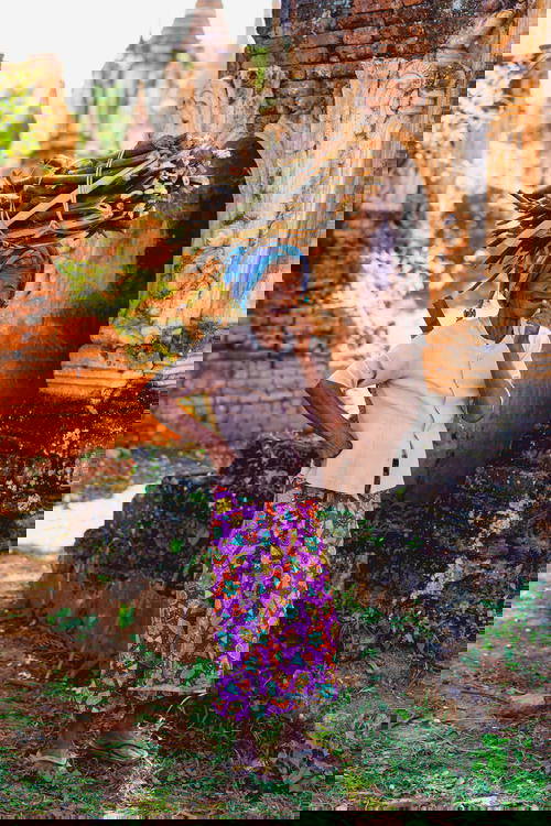 Elderly tribal Burmese ethnic woman at the pagodas of Indein Inle Lake Myanmar