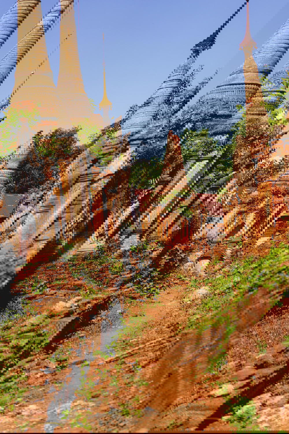 Ancient area of Buddhist stupas and pagodas on a clear hot sunny day in Indein Myanmar