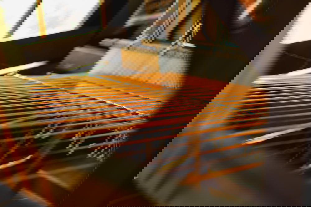 Rows of a Burmese traditional manual silk loom during the boat tour stops at Inle Lake Myanmar