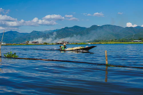 A man in a boat on Inle Lake.