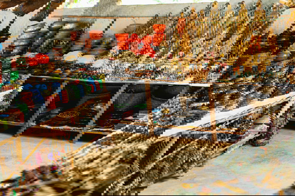 Market stall full of Buddhist replica souvenirs and lacquerware at the Burmese village of Indein in Myanmar