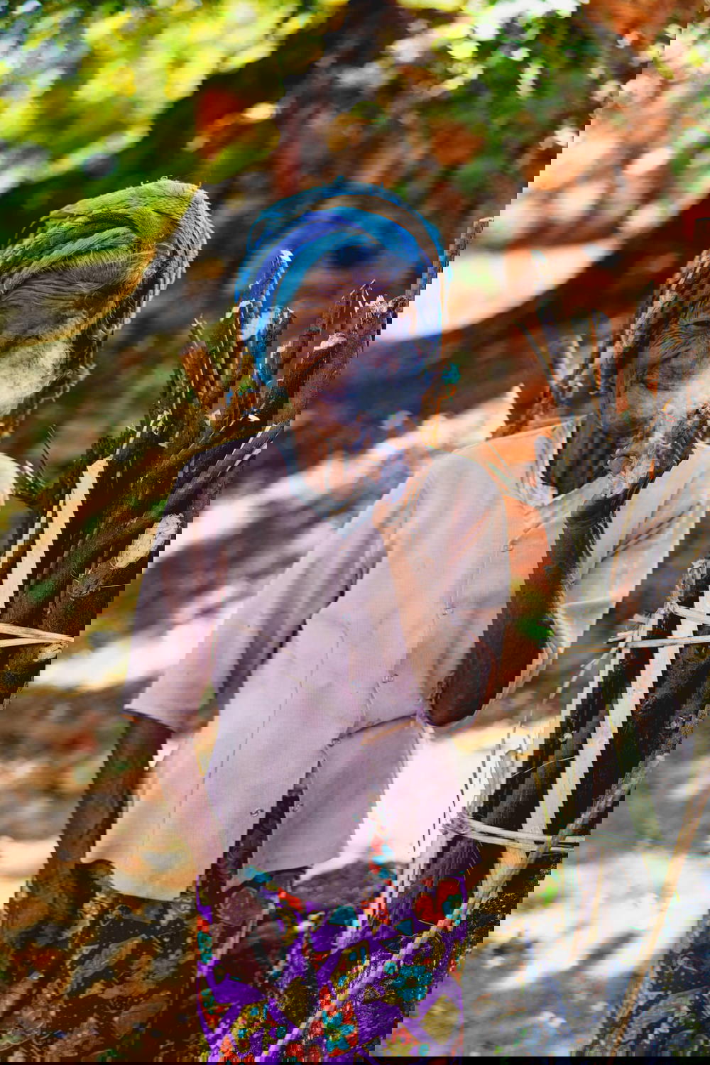 Portrait of an old Burmese ethnic minority tribal woman smoking a pipe and smiling in Indein Myanmar