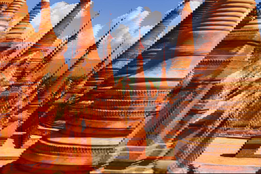 Red stone stupas at the Buddhist shrine of Indein Pagoda in Myanmar