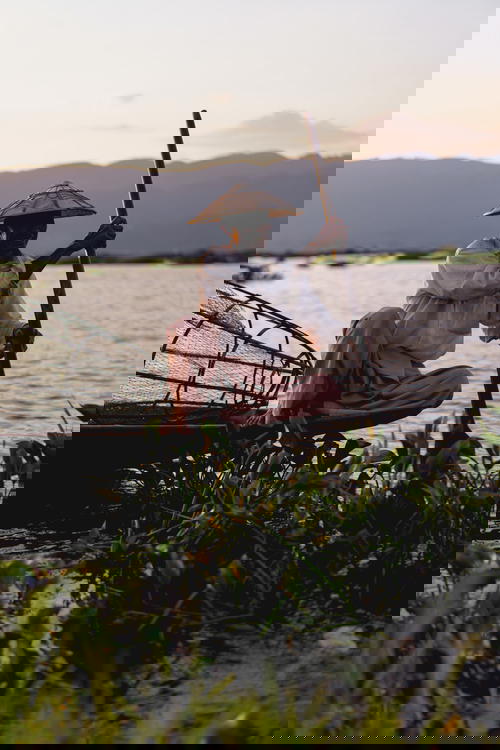 Dancing fishermen posing for photo and taking a break at Inle Lake Myanmar