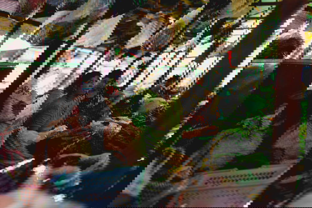 Burmese local women selling fresh greens and produce at the downtown village market of Nyaungshwe Myanmar