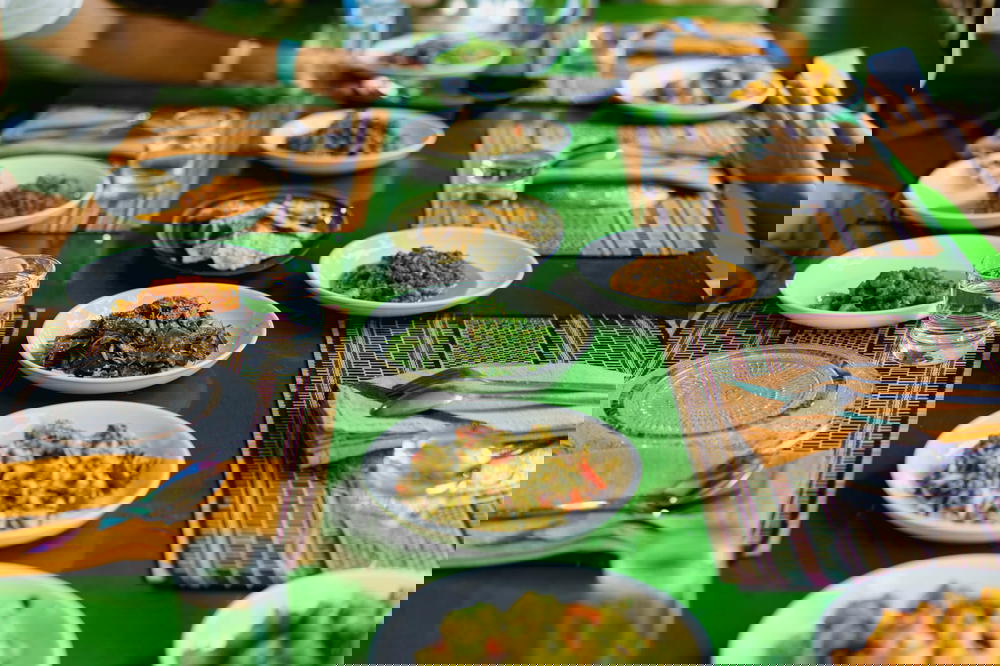 Dishes of Burmese dishes like tea leaf salad at a cooking school for tourists in Nyaungshwe Myanmar