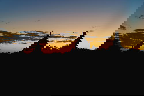 Silhouette of a Myanmar temple at sunset.