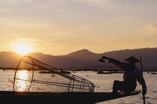 A man on a boat in Myanmar (Burma).