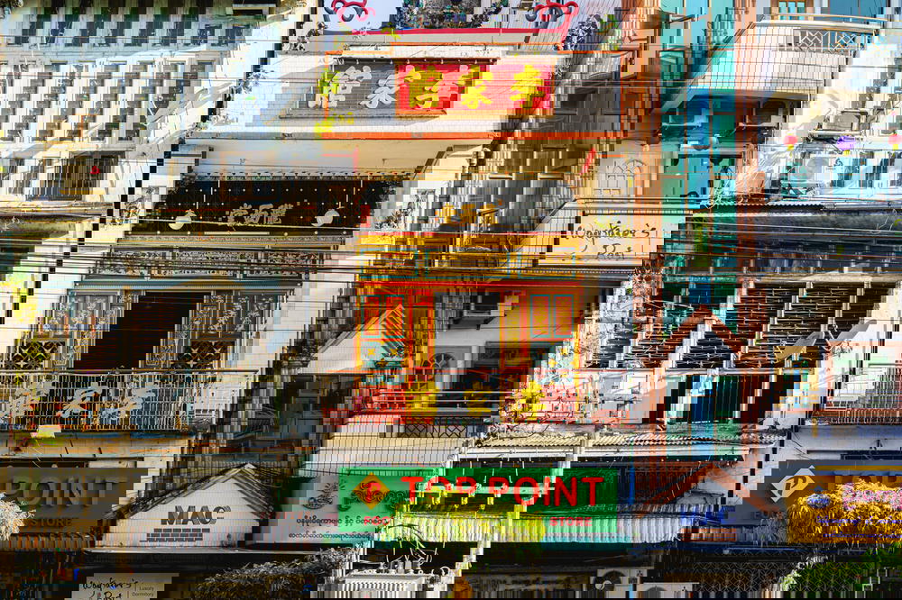 Diversity in culture and architecture among buildings of downtown Yangon with Chinese, English and Burmese signs