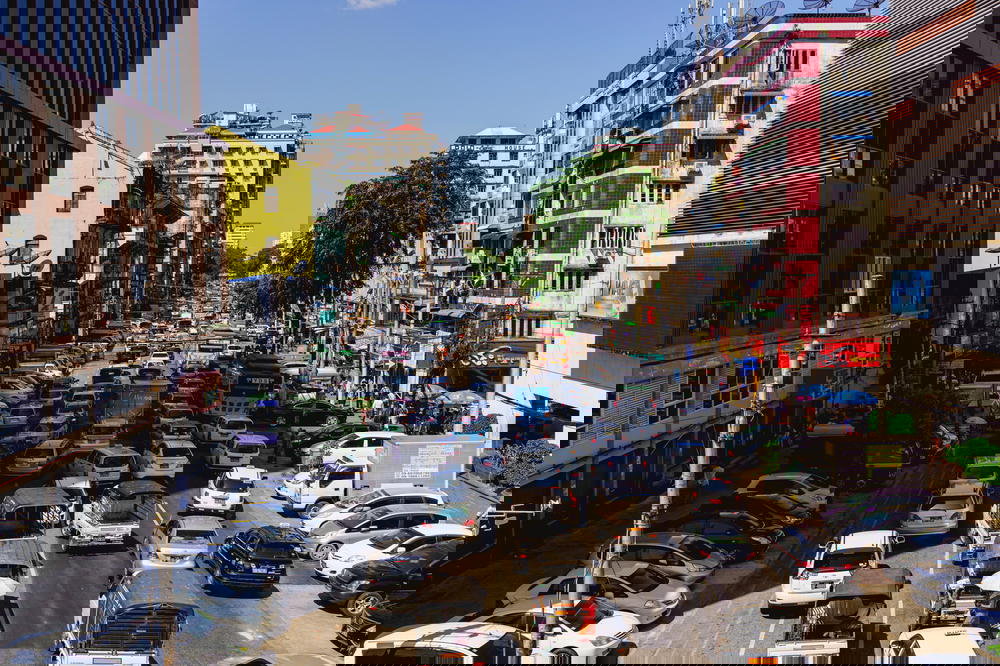 Heavy traffic in downtown Chinatown of Yangon Myanmar on one of the city main roads