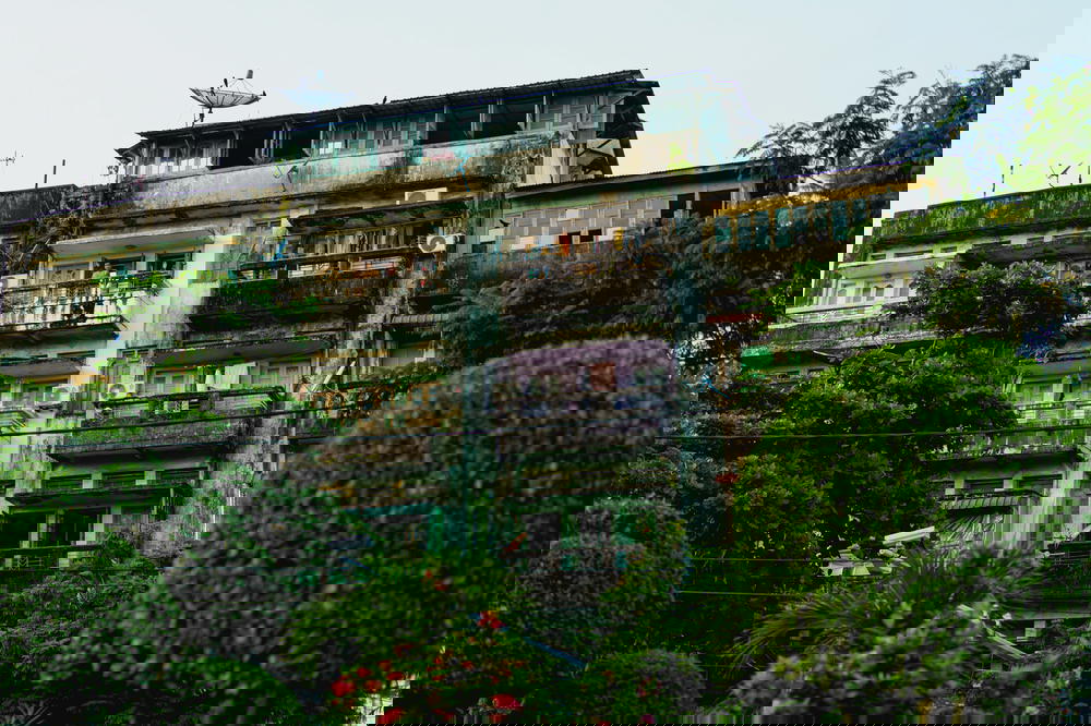 Aging and discolored residential apartment buildings near Chinatown in Yangon Myanmar