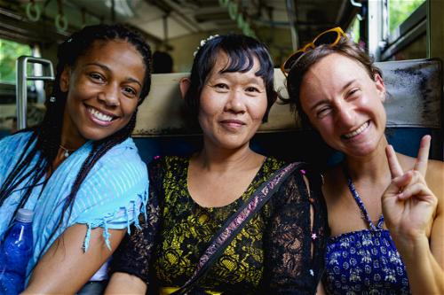 Travelers and local woman on Circle Train, Yangon, Myanmar (Burma)