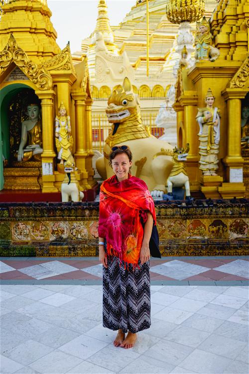 Woman wearing sarong shawl and long skirt at Shwedagon Pagoda, Yangon, Myanmar