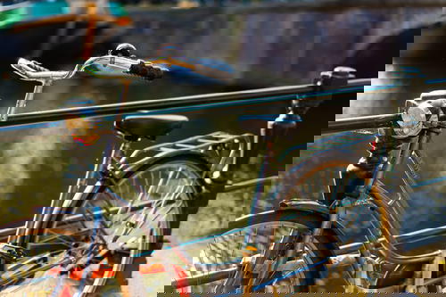 A bike alongside a railing in The Netherlands.