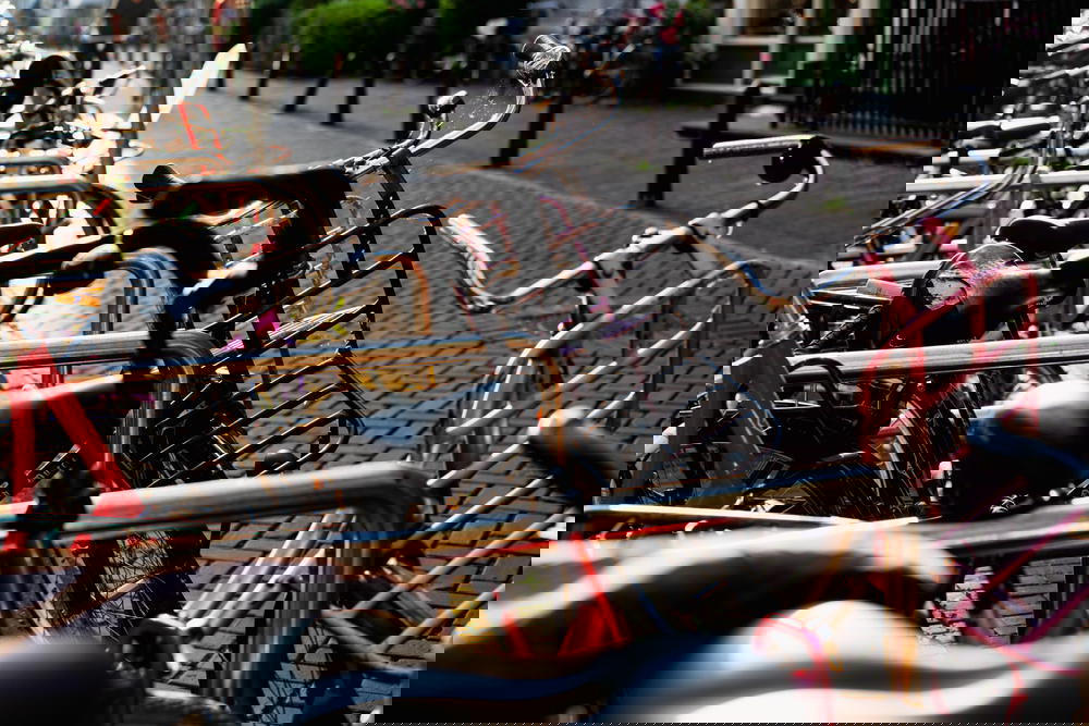 Bikes lined up on a rack in Amsterdam