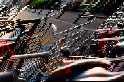 A row of bicycles parked on a sidewalk in The Netherlands.