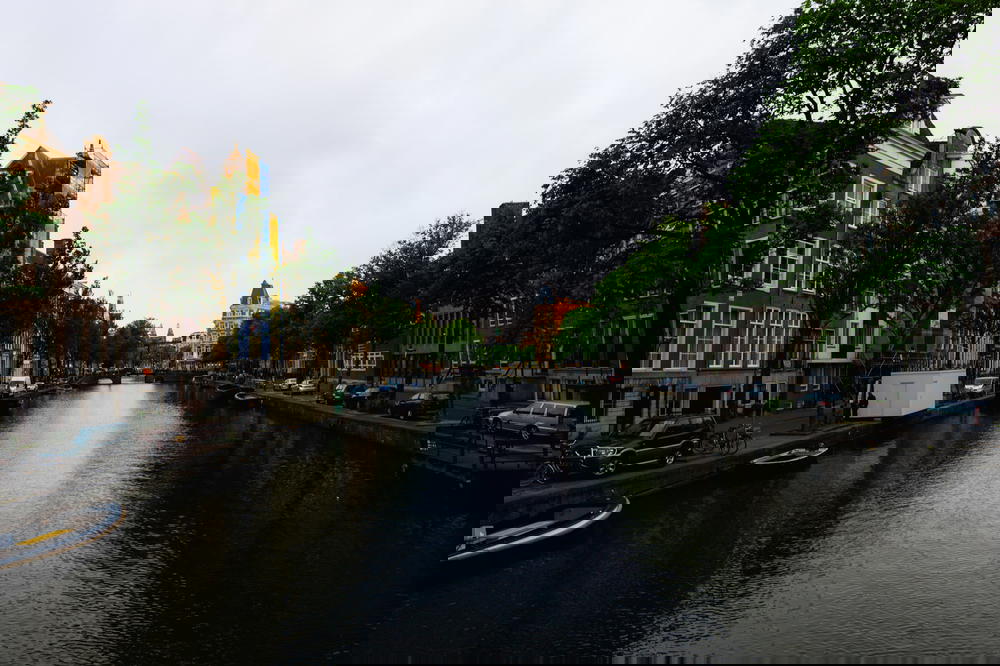 A canal in Amsterdam, showcasing iconic Dutch architecture.