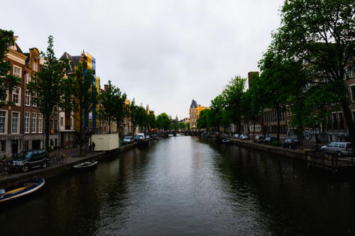 A canal in Amsterdam, showcasing iconic Dutch architecture.